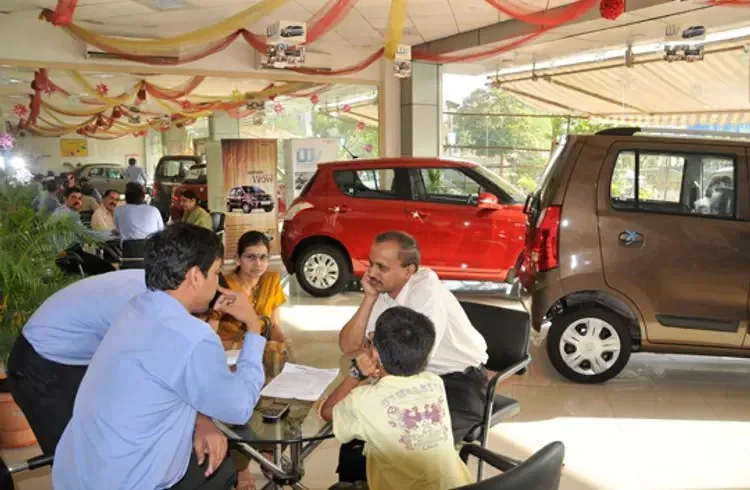 Indian customers choosing a car at a dealership