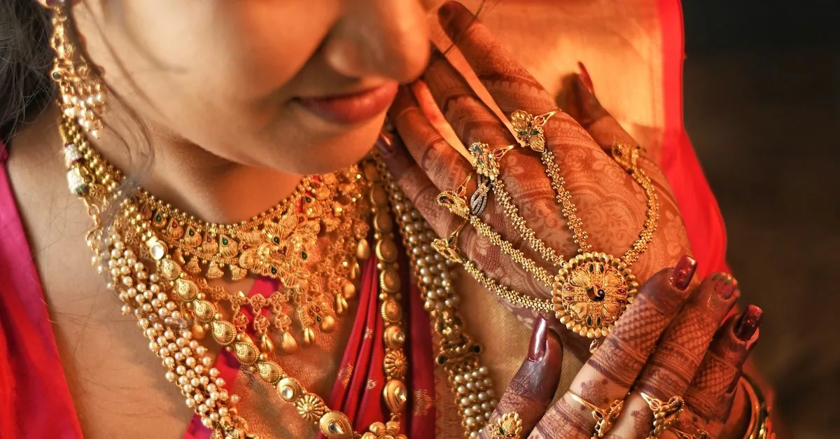Indian woman wearing traditional gold jewellery
